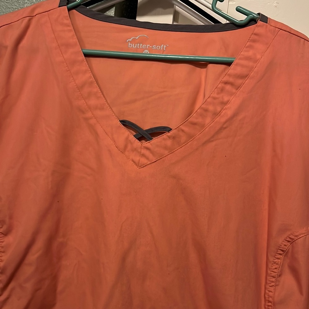 Butter soft coral and charcoal gray scrub top